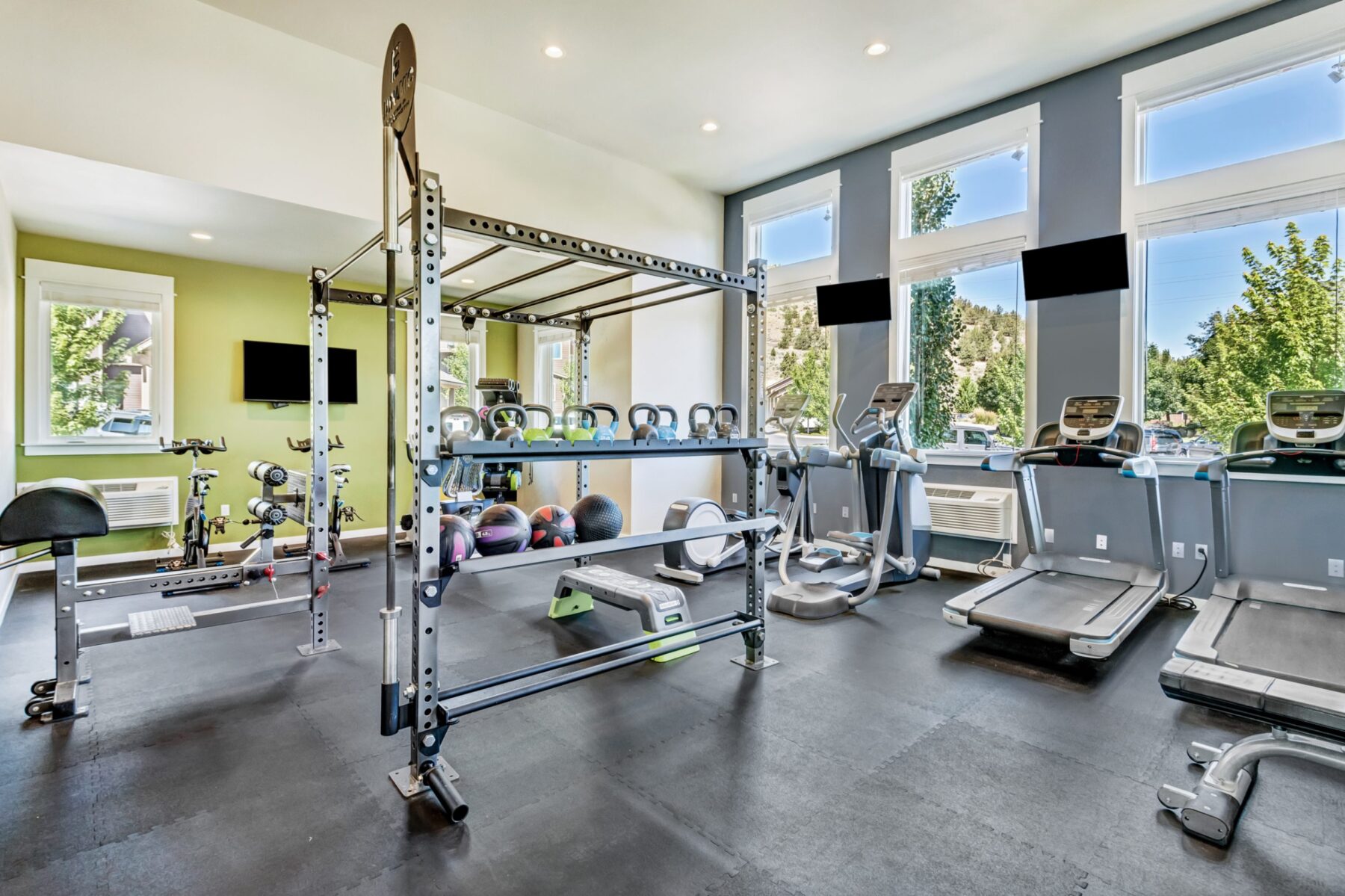 Fitness center with cardio equipment, free weights, and functional training equipment