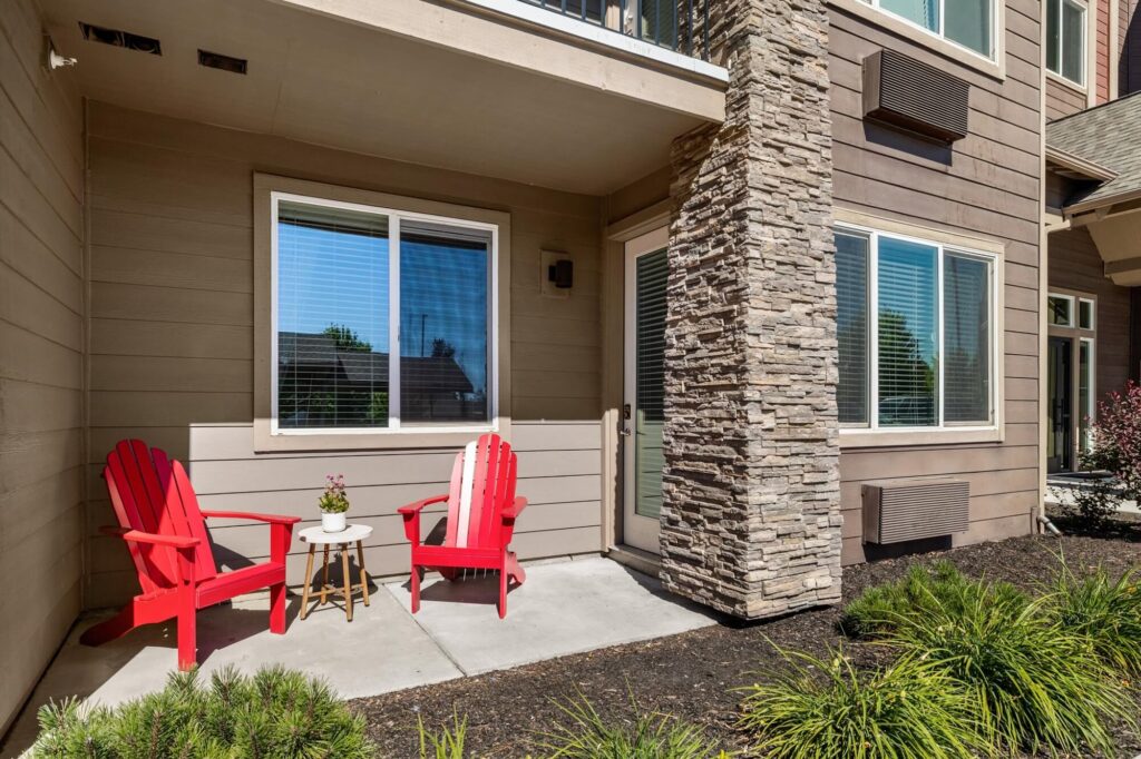 Patio space outside of apartment with lounge seating