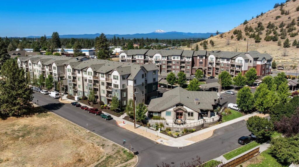 Exterior aerial view of apartment and leasing office buildings