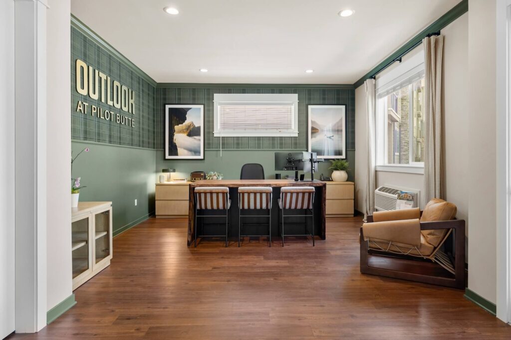 Leasing office reception area with computers and lounge seating