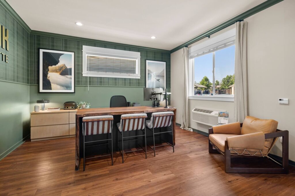 Leasing office reception area with computers and lounge seating