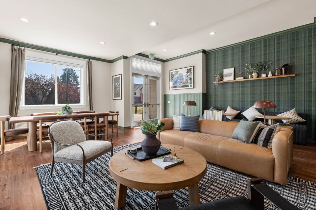 Clubhouse interior with lounge seating and dining table